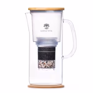 A side view of the ENYA water filter pitcher, showcasing its glass carafe, sustainable bamboo lid, and internal filter cartridge.