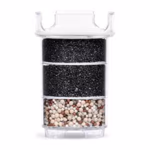 Cross-section of a Lotus Vita ENYA water filter cartridge, revealing its multi-layer system of activated carbon and mineral stones for water purification.