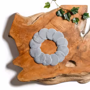 A box of 12 Lotus Vita limescale pads displayed next to two individual white filter pads on a clean background.